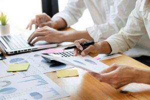 Executives coperate, Business People explaining a valuation data in modern office.